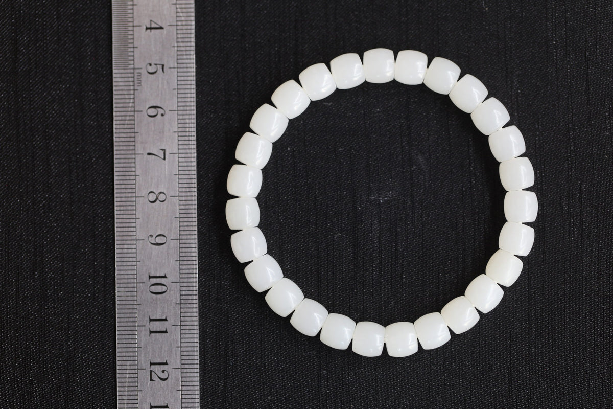 PILLAR Pill 7.8×7.2 · Suet White — nephrite jade cylinder bracelet, size reference