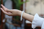 PILLAR Pill 7.8×7.2 · Suet White — nephrite jade cylinder bracelet, on the wrist, alternate view