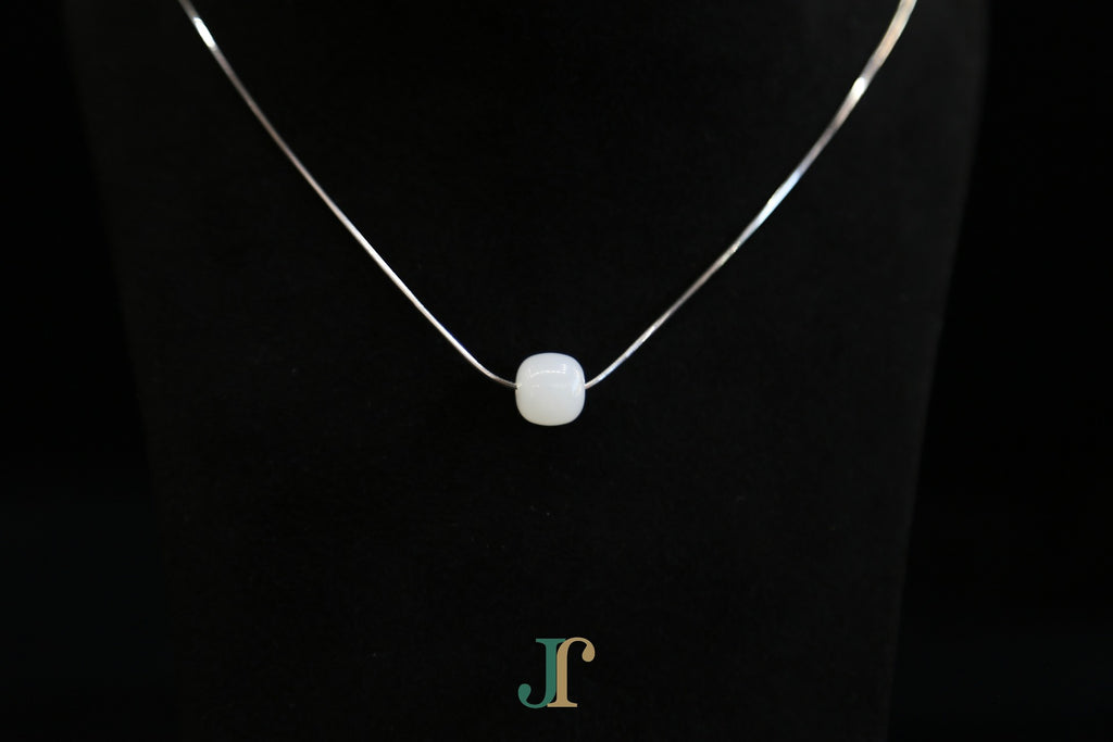 PILLAR Pure 10×9 · Suet White — nephrite jade cylinder necklace, detail