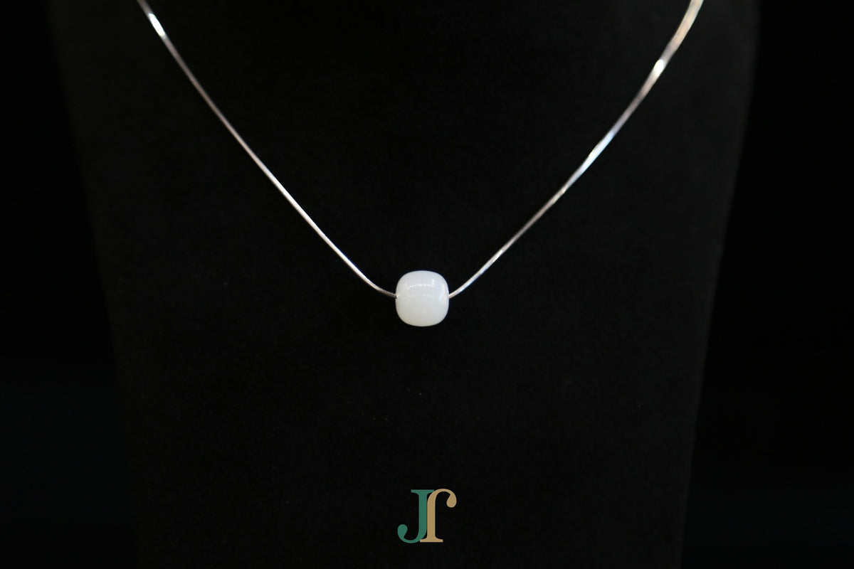PILLAR Pure 10×9 · Suet White — nephrite jade cylinder necklace, detail