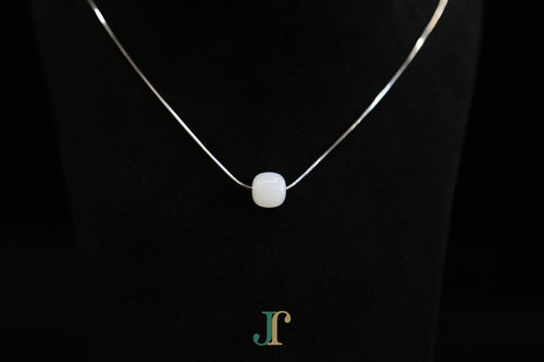PILLAR Pure 10×9 · Suet White — nephrite jade cylinder necklace, detail