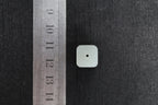 PILLAR Pure 12×9.5 · Willow Green — nephrite jade pendant, with a ruler for scale