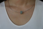 PILLAR Pure 12×9.5 · Willow Green — nephrite jade pendant, worn, second view