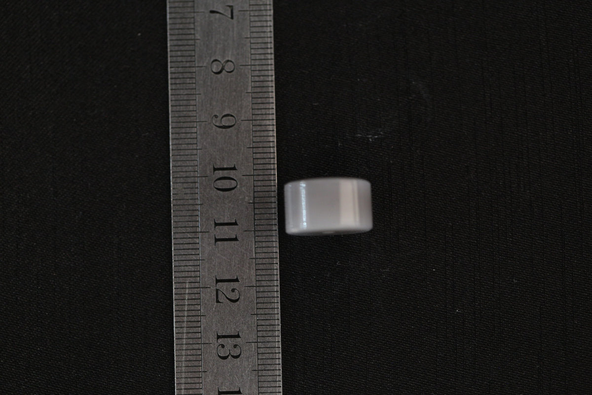PILLAR Pure 15×9 · Smoky Lilac — nephrite jade pendant, with a ruler for scale