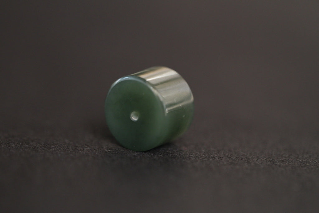 PILLAR Pure 16×11.2 · Spinach Green — nephrite jade pendant, angled view