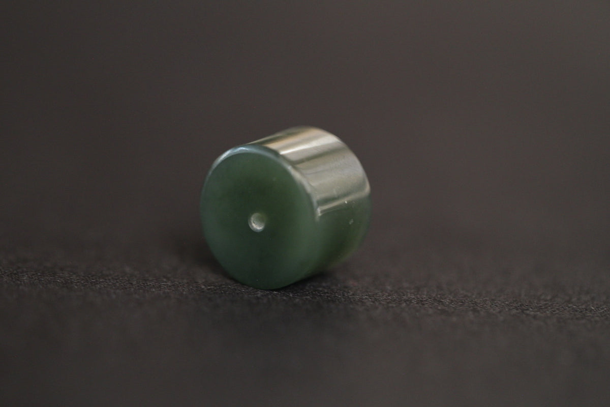 PILLAR Pure 16×11.2 · Spinach Green — nephrite jade pendant, angled view