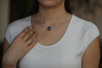 PILLAR Pure 16×11.2 · Spinach Green — nephrite jade pendant, on the model