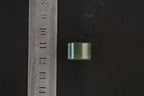 PILLAR Pure 16×11.2 · Spinach Green — nephrite jade pendant, with a ruler for scale