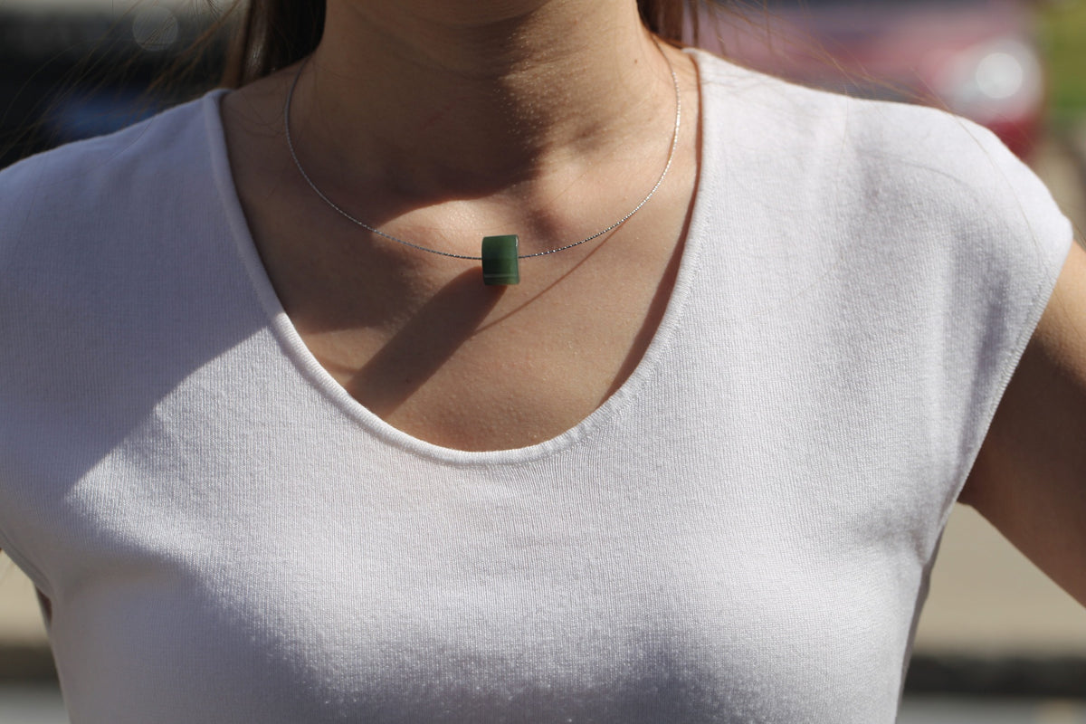 PILLAR Pure 16×11.2 · Spinach Green — nephrite jade pendant, worn, second view