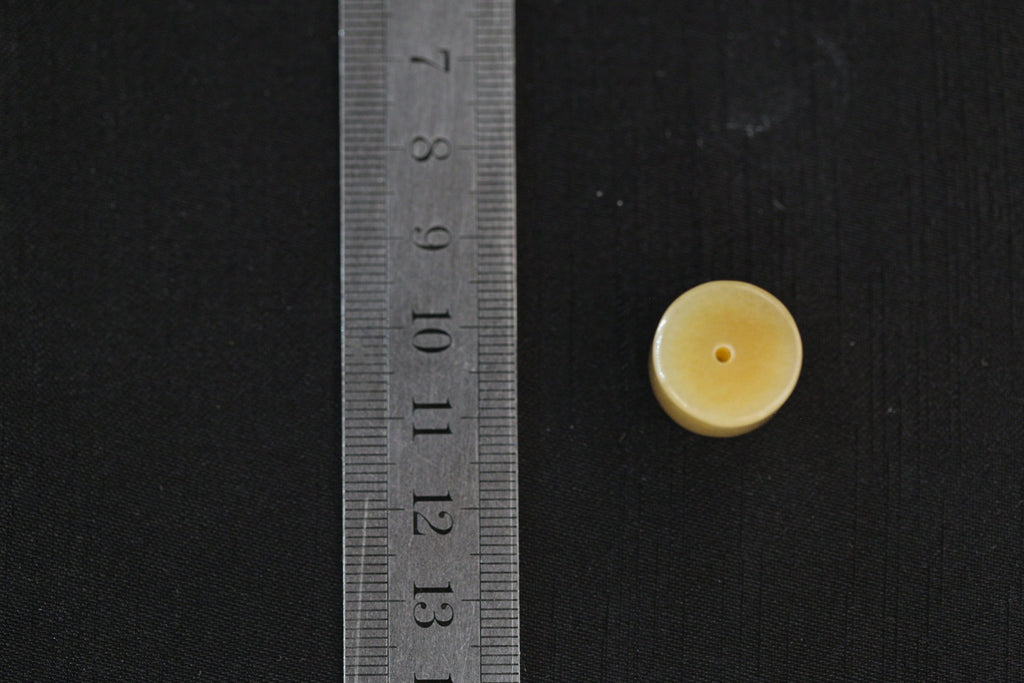 PILLAR Pure 16×12 · Multi-Colour — nephrite jade pendant, with a ruler for scale