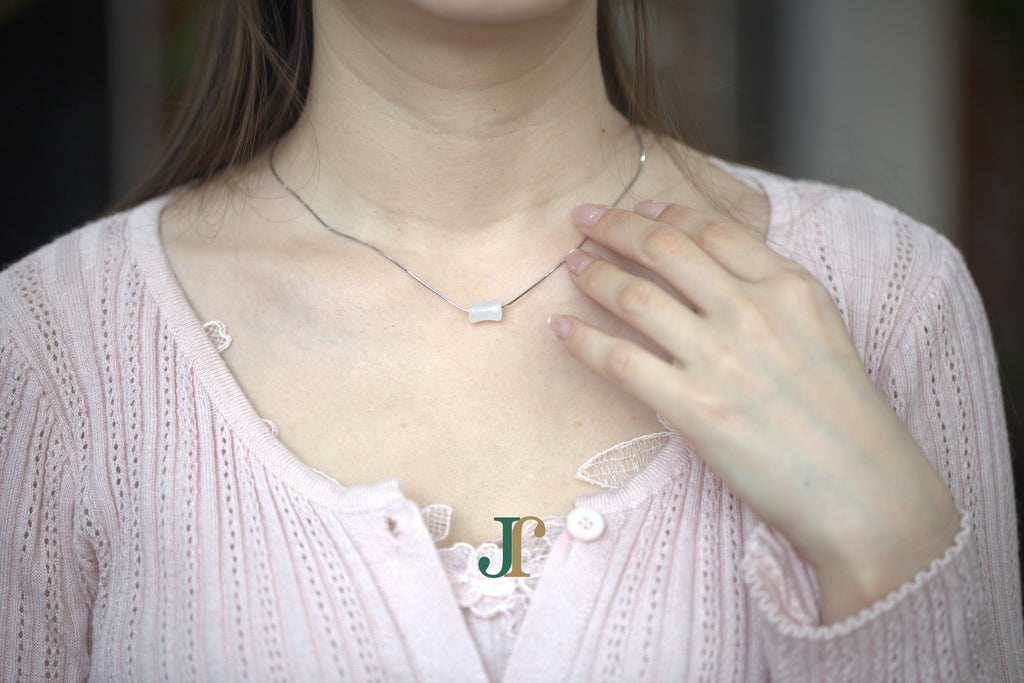 PILLAR Pure 6×12 · Suet White — nephrite jade cylinder necklace, worn