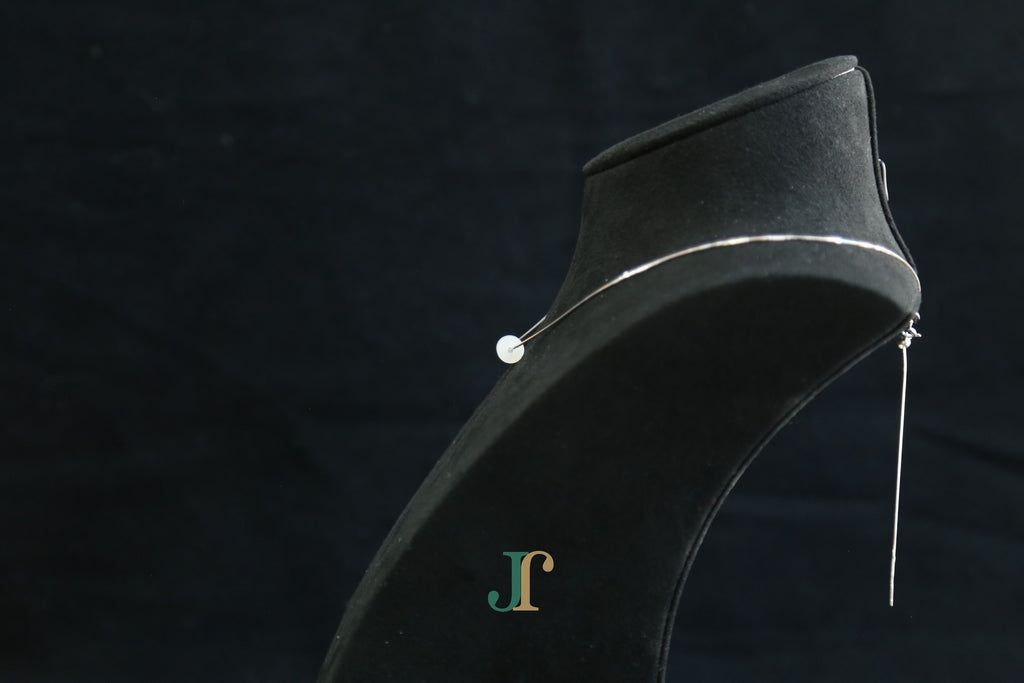 PILLAR Pure 6×12 · Suet White — nephrite jade cylinder necklace, on a display bust, side view