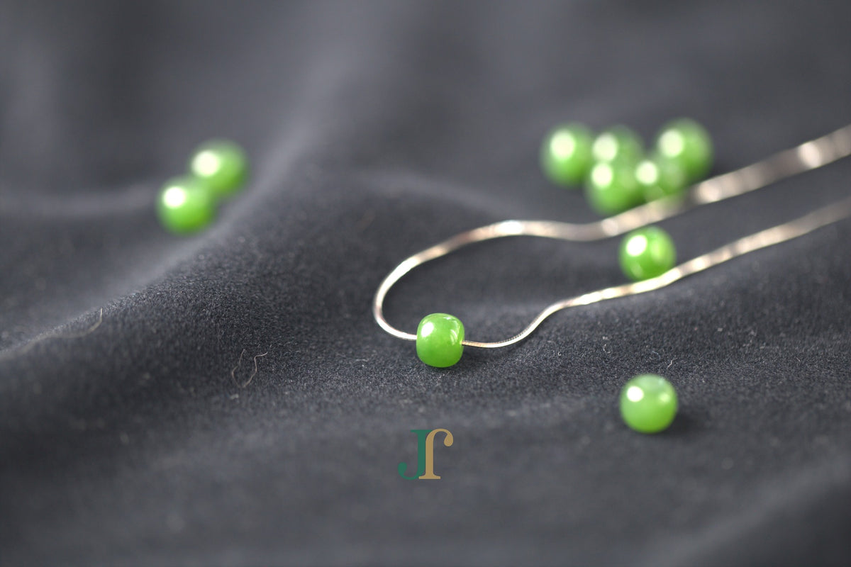 PILLAR Pure 7×6 · Spinach Green — nephrite jade cylinder necklace, on the chain