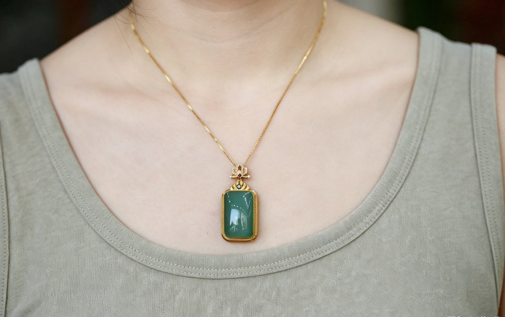 TABULA 005 · Willow Green — nephrite jade pendant, on the model