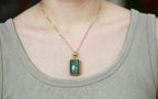 TABULA 005 · Willow Green — nephrite jade pendant, on the model