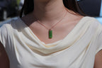 TABULA 007 · Willow Green — nephrite jade pendant, on the model