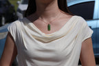 TABULA 007 · Willow Green — nephrite jade pendant, on the model