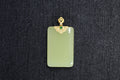 TABULA 008 · Golden Green — nephrite jade pendant, front