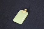 TABULA 008 · Golden Green — nephrite jade pendant, close view