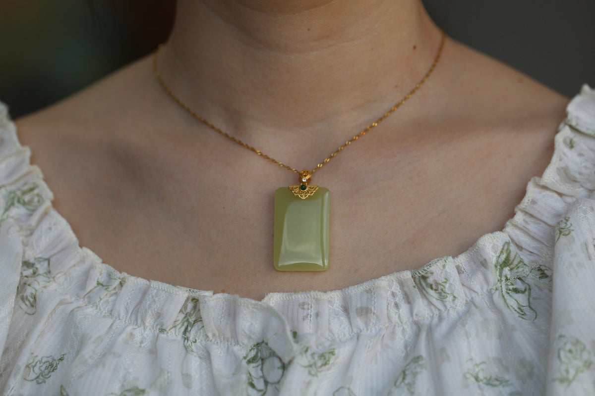 TABULA 008 · Golden Green — nephrite jade pendant, on the model