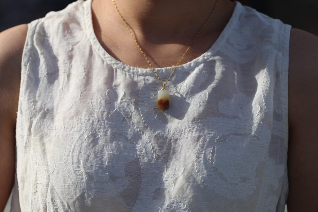 TABULA 010 · Multi-Colour — nephrite jade pendant, on the model, close