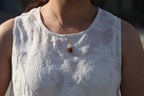 TABULA 010 · Multi-Colour — nephrite jade pendant, on the model