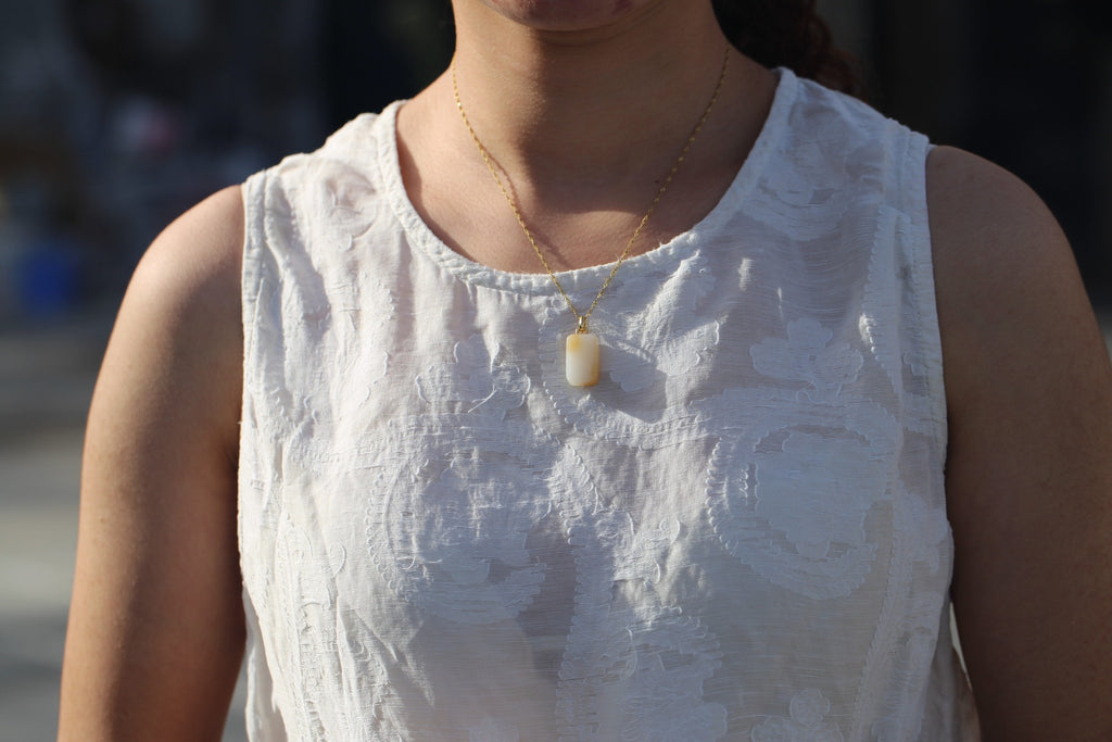 TABULA 011 · Multi-Colour — nephrite jade pendant, on the model, close