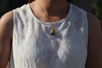 TABULA 012 · Multi-Colour — nephrite jade pendant, on the model, close