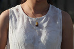 TABULA 012 · Multi-Colour — nephrite jade pendant, on the model