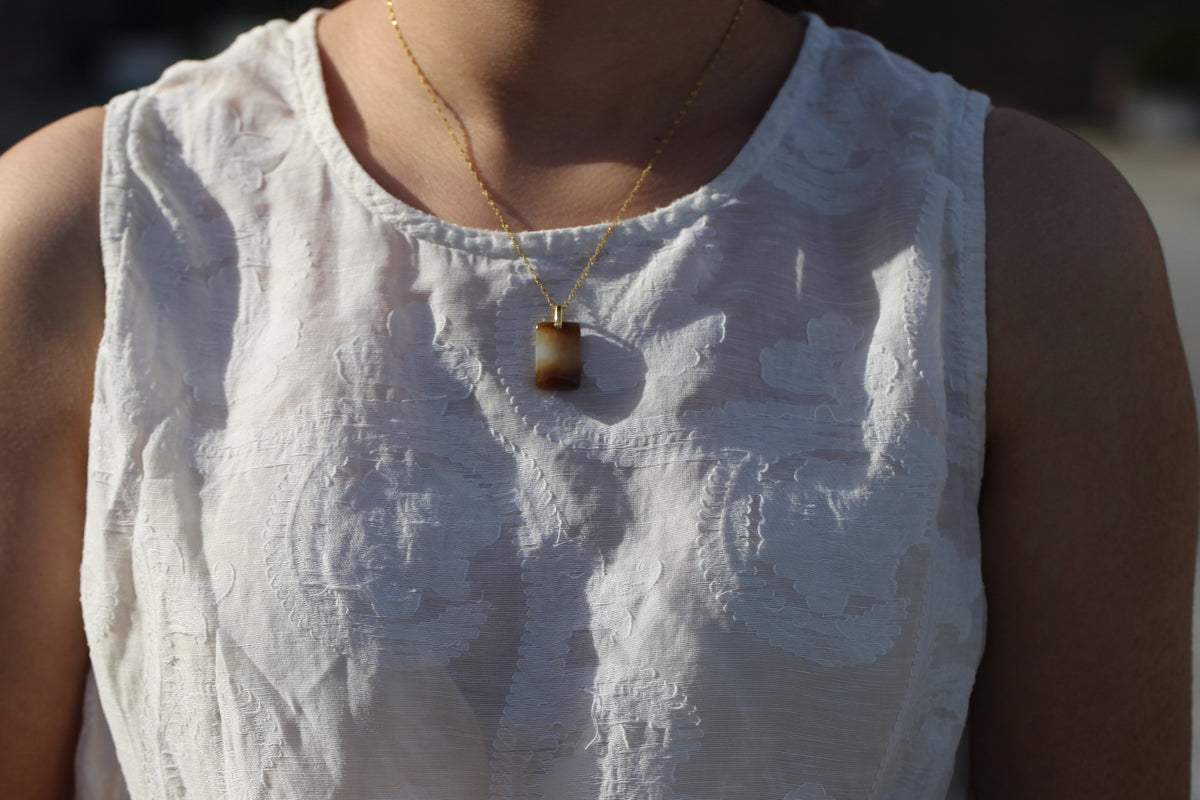 TABULA 013 · Multi-Colour — nephrite jade pendant, on the model, close