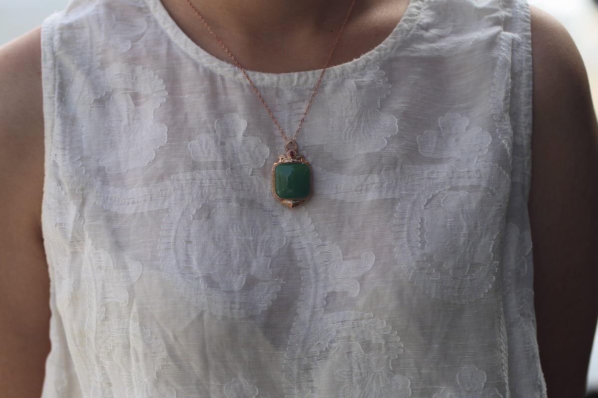 TABULA 014 · Willow Green — nephrite jade pendant, on the model