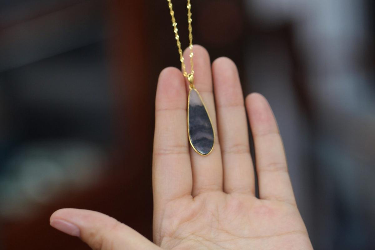 TABULA 016 · Ink Wash — nephrite jade pendant, in the hand