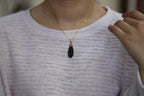 TABULA 016 · Ink Wash — nephrite jade pendant, on the model