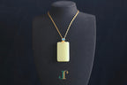 TABULA 017 · Golden Green — nephrite jade pendant, on a display bust