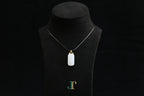TABULA 018 · Suet White — nephrite jade pendant, on a display bust