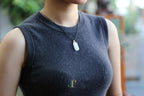 TABULA 018 · Suet White — nephrite jade pendant, worn
