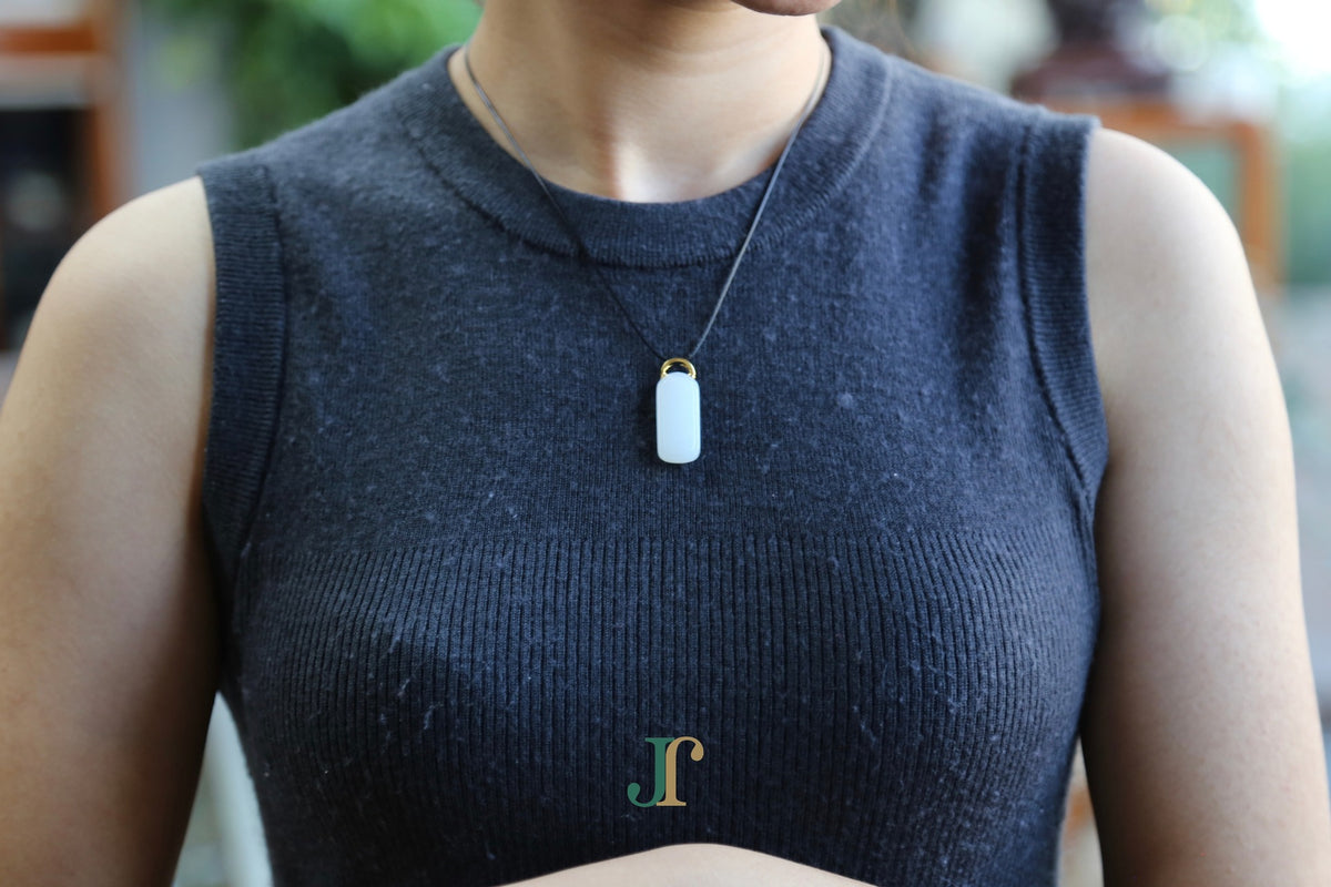 TABULA 019 · Suet White — nephrite jade pendant, worn
