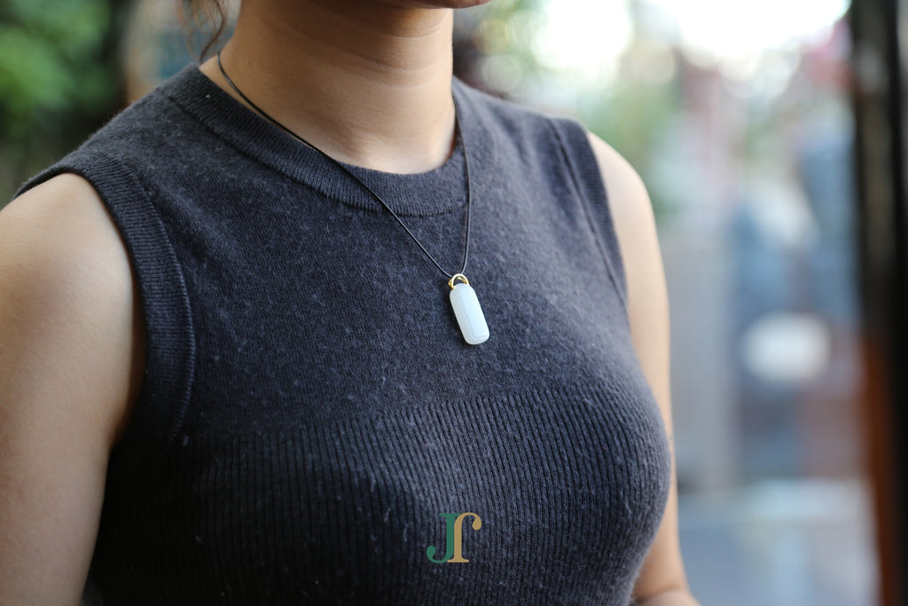 TABULA 019 · Suet White — nephrite jade pendant, worn, second view