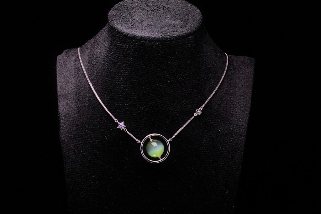 URANIA Planet · Cat's Eye — nephrite jade necklace, on a display bust