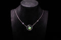 URANIA Planet · Cat's Eye — nephrite jade necklace, on a display bust