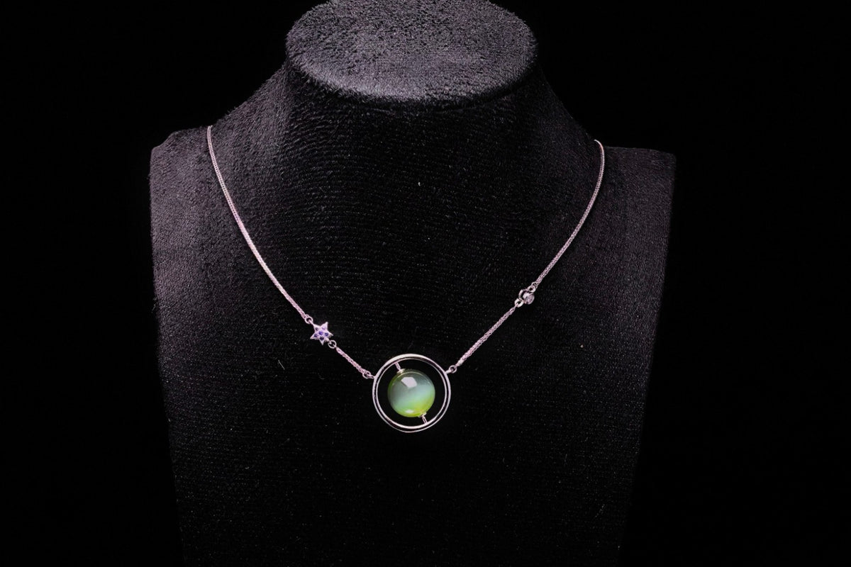 URANIA Planet · Cat's Eye — nephrite jade necklace, on a display bust