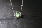 URANIA Planet · Cat's Eye — nephrite jade necklace, on the model